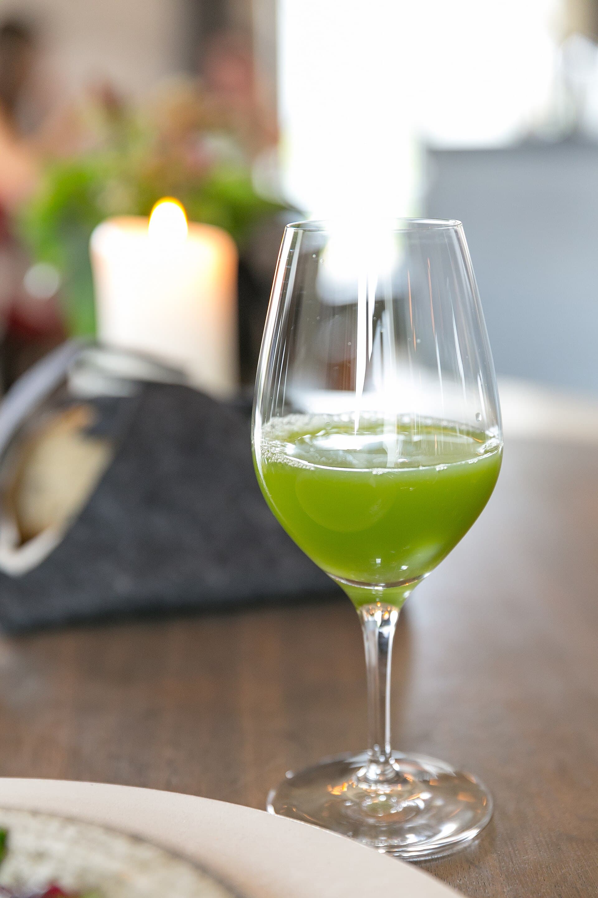 A glass of fresh green vegetable juice