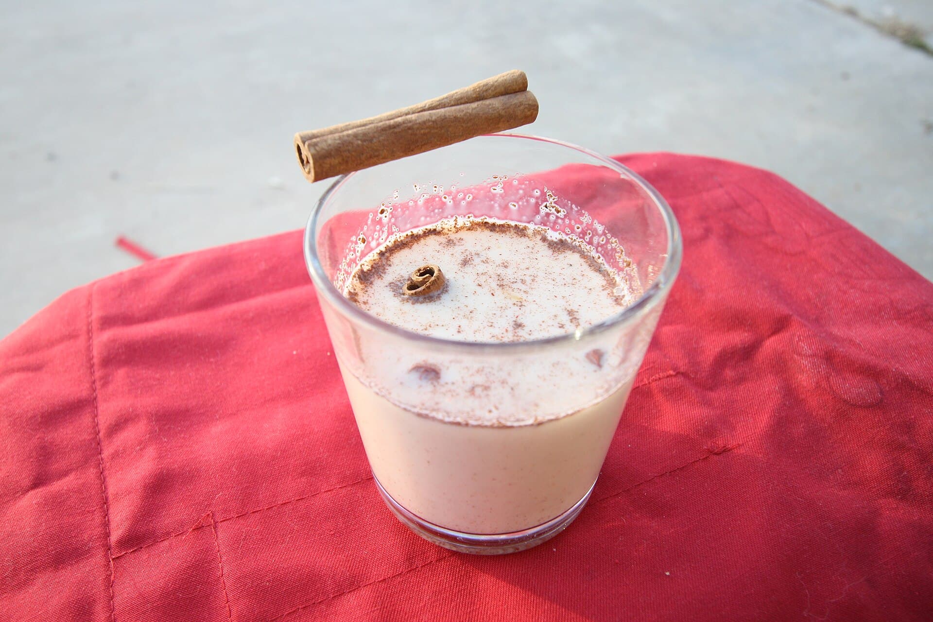 A creamy egg and milk drink in a glass