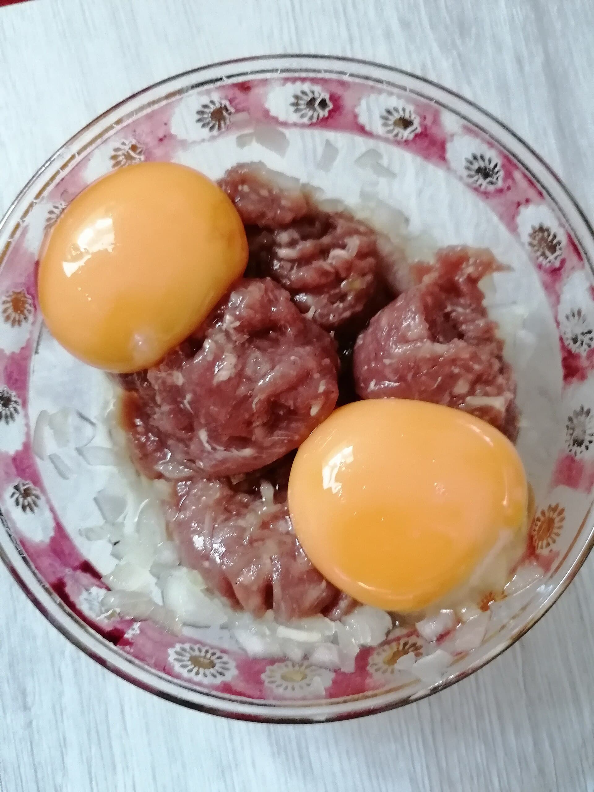 Polish beef tatar with raw egg yolks