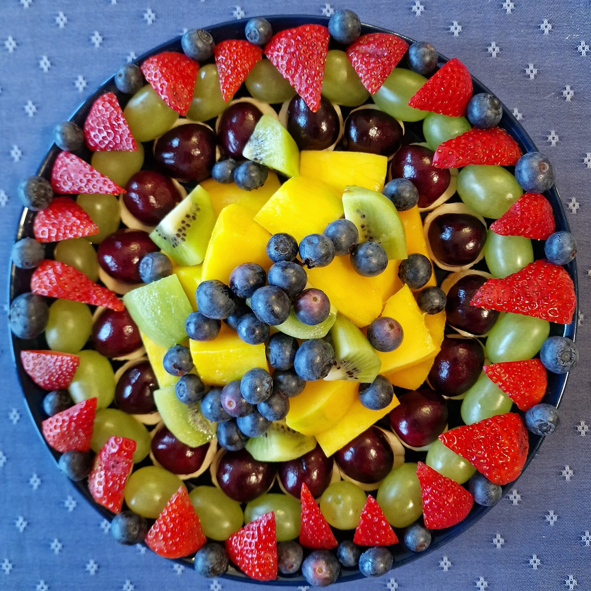 A round platter of fresh tropical fruit